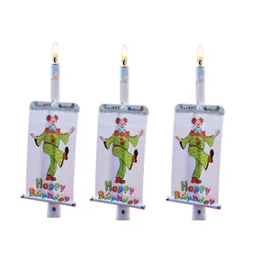 Detail view of musical birthday candles with clown banners and Happy Birthday text