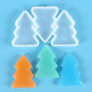 Macro view of Christmas tree silicone mold with colorful finished resin ornaments.