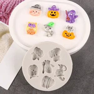 Detailed view showing a round Halloween silicone mold with pumpkin and ghost shape cavities