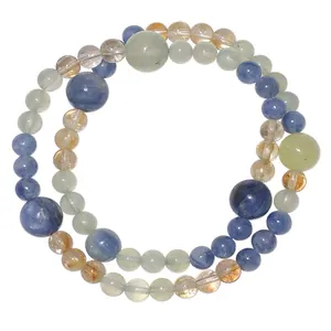 Detailed view of natural kyanite and prehnite crystal beads in a circular arrangement