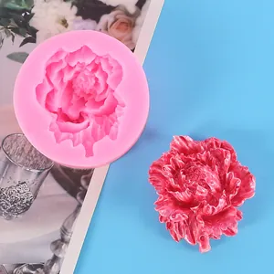 Close-up of carnation flower silicone mold with red plaster floral craft piece