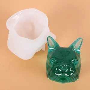 Detail of French Bulldog 3D silicone mold with green resin dog head finished product.