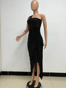 One-shoulder black pleated sequined long evening gown with high slit on mannequin