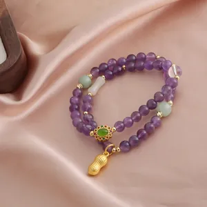 Bracciale a doppio filo in ametista viola con perline di giada e ciondolo arachide d'oro