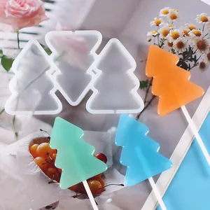 Detailed view of DIY Christmas tree silicone lollipop mold showing finished candies and mold texture