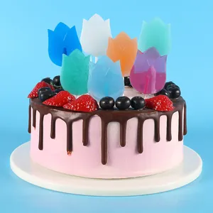 Detail view of vibrant tulip flower chocolate toppers used for cake decoration
