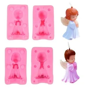 Detail view of 3D angel silicone molds and finished decorative angel candles for DIY