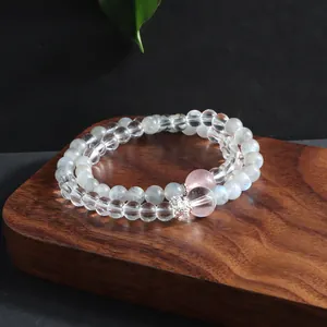 Close-up detail of double-strand natural crystal bracelet featuring gray moonstone beads