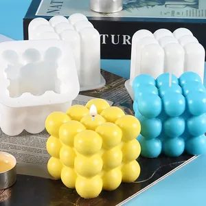 Bubble cube silicone mold for DIY candles and baking, showing yellow and blue results