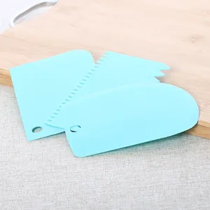 3-piece set of light blue plastic cake scrapers with straight, curved, and jagged edges