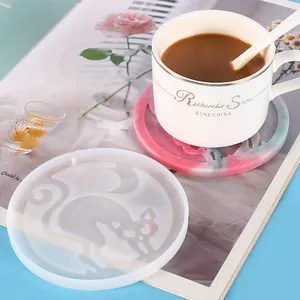Close-up of a DIY Halloween silicone mold showing the cat-shaped resin coaster detail