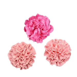 Detailed macro view of pink carnation-shaped handmade soap or plaster decorations