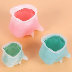 Detailed view of three sizes and colors of DIY French Bulldog head silicone molds for epoxy