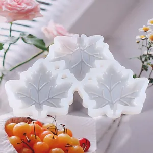 Detailed view of the three interconnected maple leaf shaped translucent silicone mold.