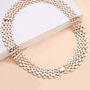 Detailed macro view of a rose gold wide mesh chain necklace in punk hip-hop style.