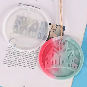 Detailed view of Halloween house pendant mold and colorful finished resin craft