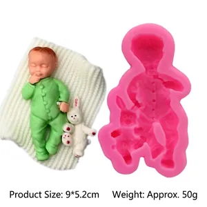 Detail view of 3D baby silicone mold with finished wax figure and rabbit