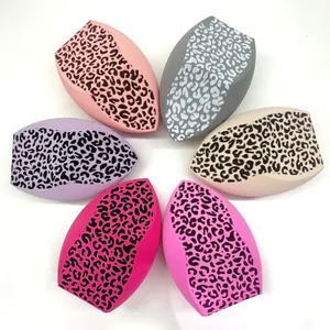 Detailed view of six leopard print makeup sponges in various colors arranged in a circle