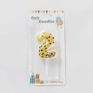 Close-up of a cartoon leopard pattern number 2 birthday candle for kids party decor