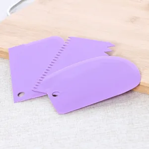 Purple plastic 3-piece baking scraper set for cake decorating and dough cutting tasks
