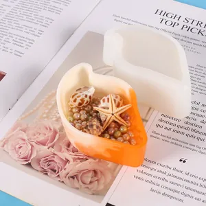 Bladvormige siliconen gietvorm voor hars met oranje schaal en decoratieve schelpen