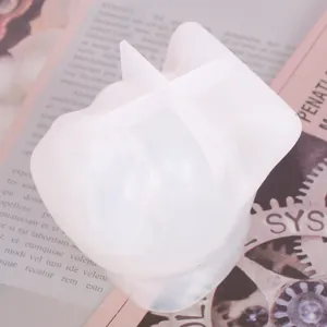 Close-up detail of a white silicone French Bulldog head mold for DIY resin crafts.