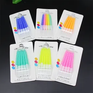 Detail view of colorful spiral birthday candles in various 10-piece packaging packs
