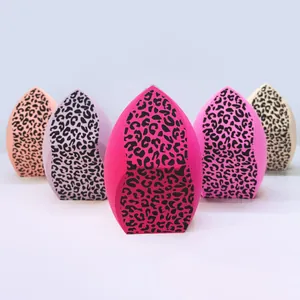 Macro view of leopard print makeup sponges featuring a unique three-sided cut design