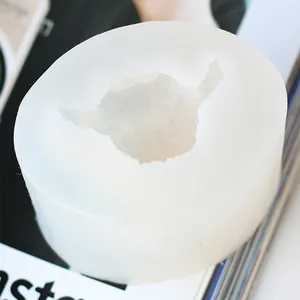 Close-up detail view of a teddy dog head cavity in a flexible white silicone mold