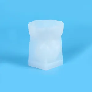 Detail shot of white translucent silicone mold for DIY blindfolded girl candle making