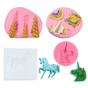 Detail view of pink silicone unicorn molds with finished resin unicorn creations