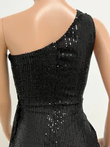 Close-up of black one-shoulder sequined evening dress showing shimmering texture
