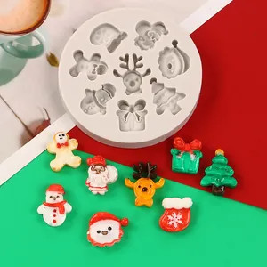 Detail view of Christmas themed silicone mold with resin Santa and reindeer craft pieces.