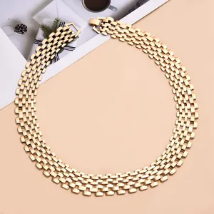 Close-up detail of an elegant chunky gold punk style wide link chain necklace for women