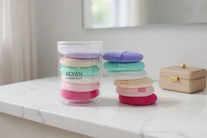 Detailed view of ALYAN powder puff set with six colorful puffs in a clear cylinder