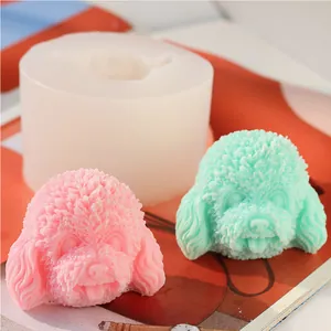 Detailed macro view of poodle dog head silicone mold with pink and green wax finished models