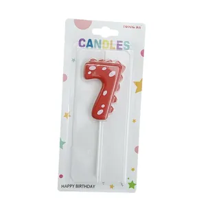 Red dinosaur number 7 birthday candle for kids cake decoration in retail packaging