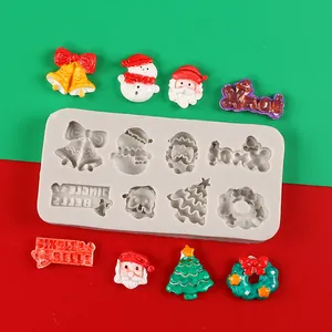 Detailed Christmas silicone mold featuring Santa Claus, tree, and jingle bells icons.