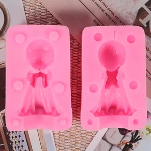 Detail of pink 3D silicone molds for angel-shaped boy and girl candles or soaps