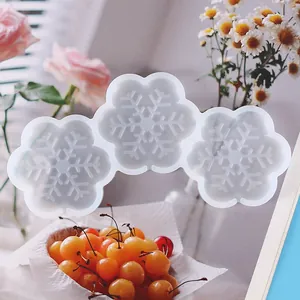Detailed view of translucent silicone mold with three snowflake flower shapes for DIY baking
