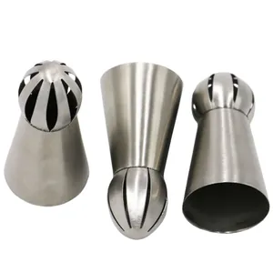 Detail view of three stainless steel Russian ball piping tips for cake decorating tools
