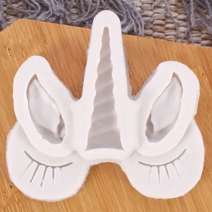 Close-up of white unicorn head silicone mold for fondant and chocolate cake decoration