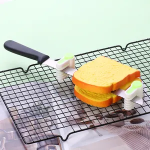 Close-up of bread slicer leveling tools used with a serrated knife for slicing toast