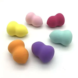 Macro view showing the soft texture of six colorful gourd-shaped makeup sponges