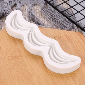 Detailed macro view of white silicone wave fondant mold for elegant wedding cake borders