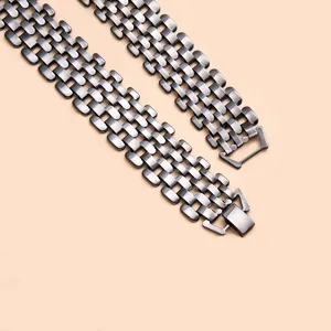 Macro view showing the intricate gunmetal wide woven punk style chain necklace links