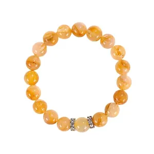 Elegante pulsera de cuarzo rutilado dorado con detalles de cristal brillante para mujer