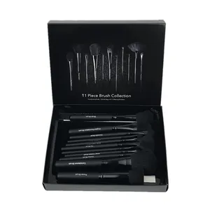 Professional 11-piece makeup brush set featuring elegant matte black wooden handles