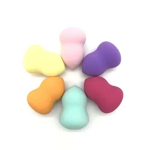 Six colorful gourd-shaped professional makeup sponges arranged in a symmetrical circle