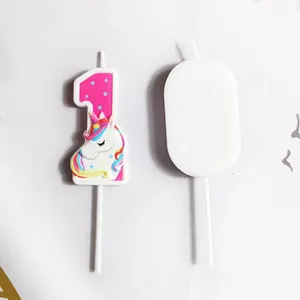 Close-up showing front and back details of pink unicorn number 1 birthday candle